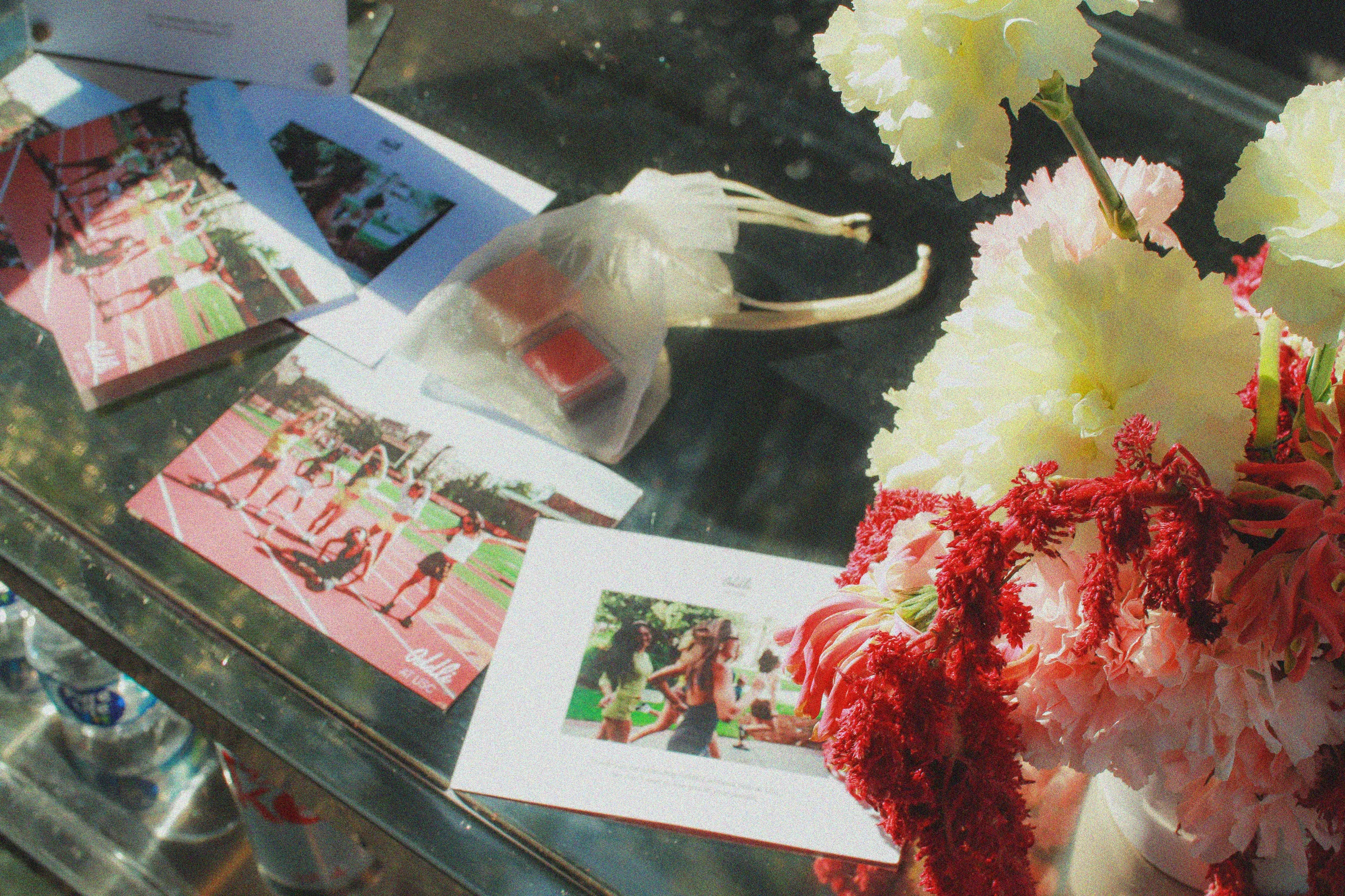 Printed photos and flowers on the display table